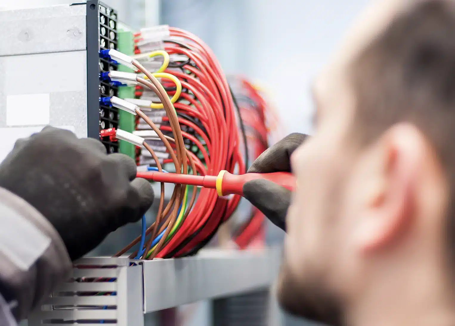 Electrician working on electric box